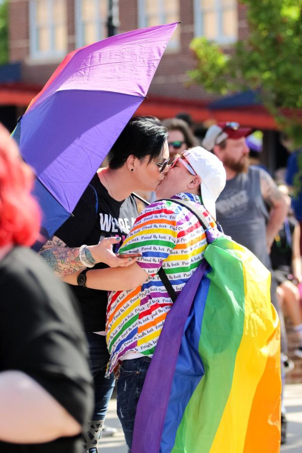 A couple kiss to celebrate pride at the Unity March held on June 25, 2022.