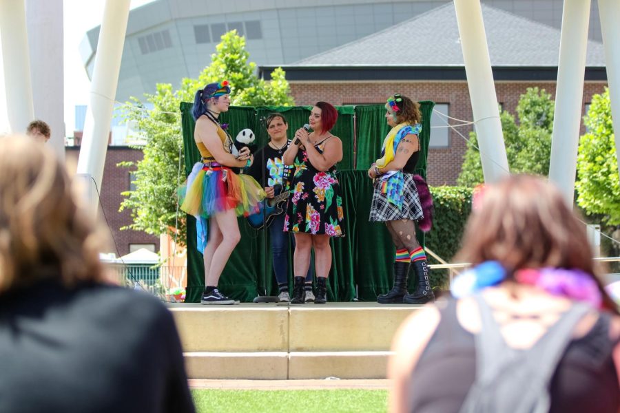 A couple share their marriage vows on stage at the Family Picnic event. The celebration was held at Naftzger Park on June 25, 2022.