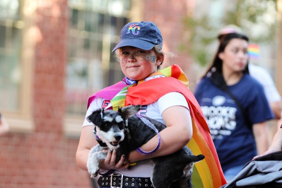 Pride event goer march with their dog at the Unity March held on July 25, 2022. The event ended at Naftzger park with a family picnic.