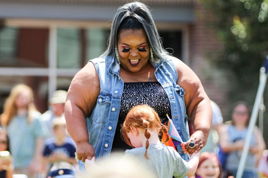 Iris Fay Moonwalker dances with event goer at the Family Picnic on June 25, 2022.