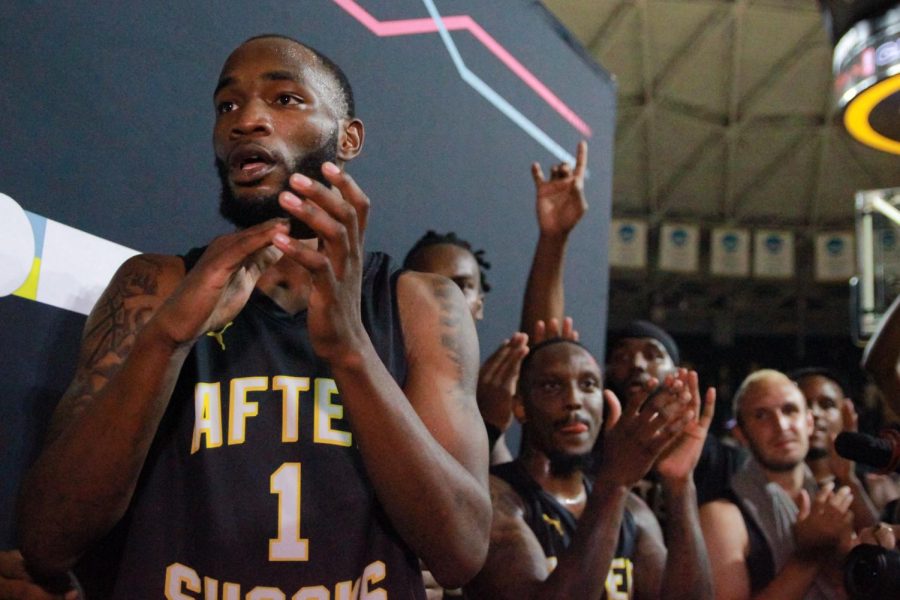 WSU Mens Basketball Alumni Markis McDuffie and the AfterShocks team celebrate after winning the first round of TBT 2022.