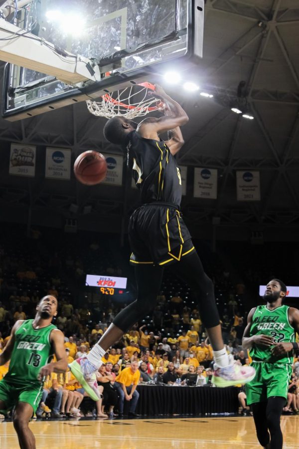 Markis McDuffie dunks during TBT Wichita Regional Final. AfterShocks played against Bleed Green and won 70-69.