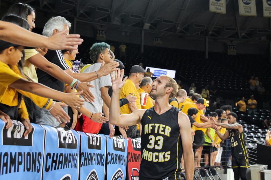 Conner+Frankamp+gives+fans+high-fives+after+TBT+Wichita+Regional+Final.+The+AfterShocks+won+70-69+against+Bleed+Green+on+July+25%2C+2022.+%28File+photo%29