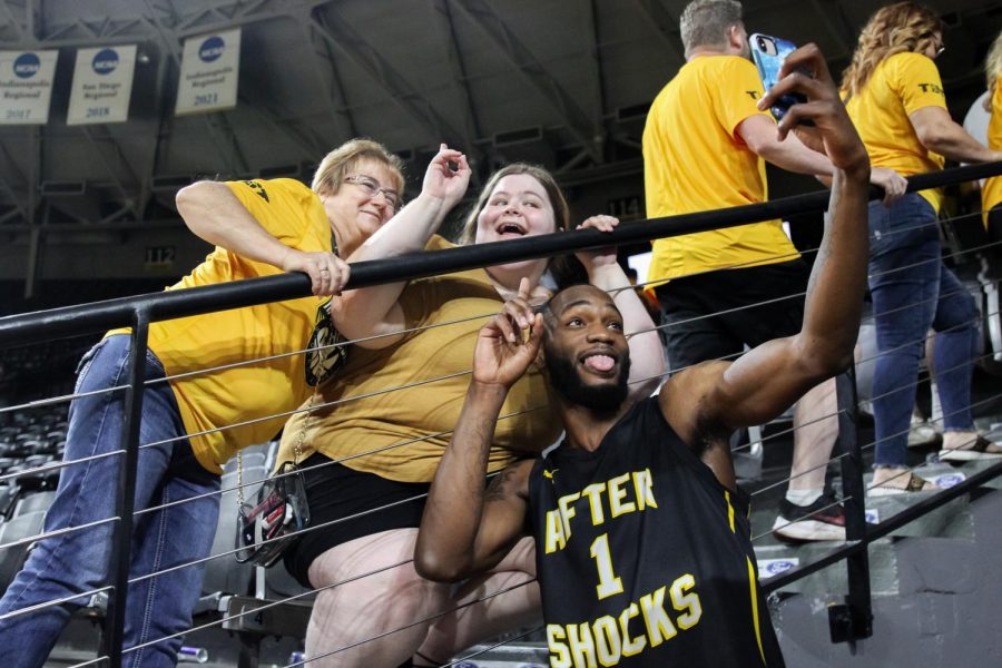 Markis McDuffie takes selfies with AfterShocks fans after the game against Bleed Green. AfterShocks won 70-69. TBT will return to Charles Koch Arena in July 2023.