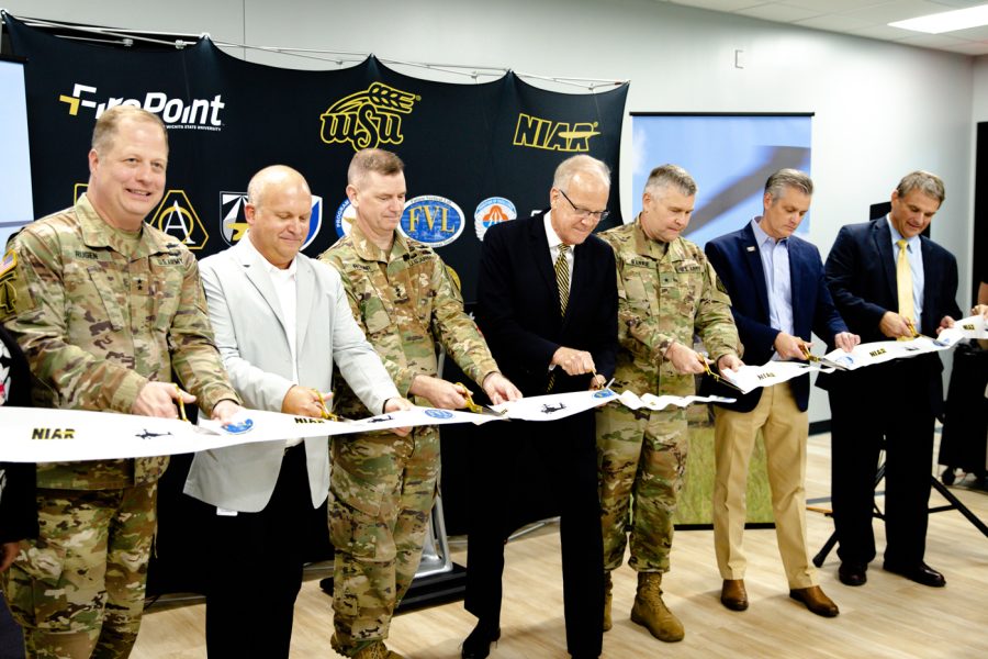 Members of WSU Army Aviation Panel cut a ribbon  after the announcement of the third digital twin project between WSU and the U.S. military.