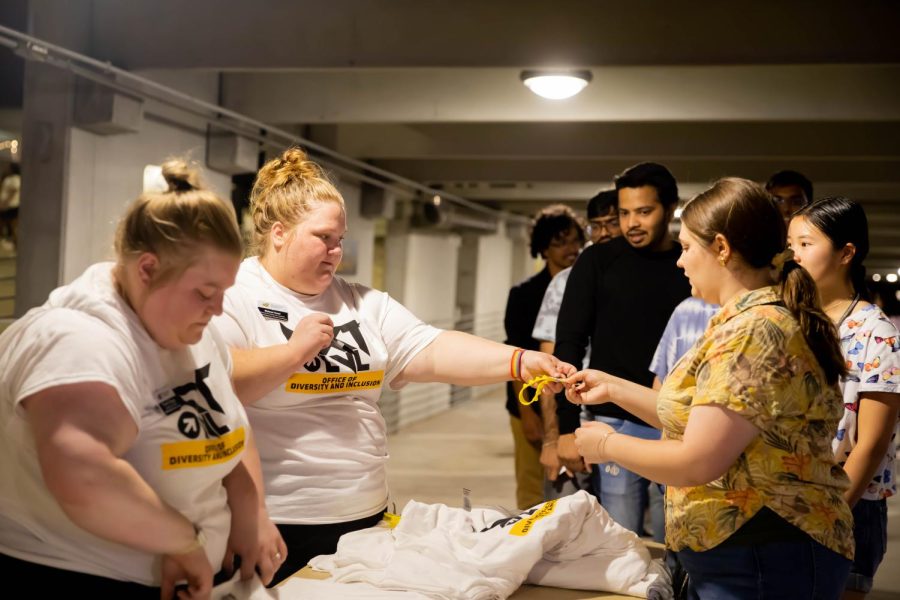 WSU students receiving T-shirts at the 2nd Annual NXT LVL Garage party. The event was hosted by the Office of Diversity and Inclusion at the public parking garage on August 19, 2022.
