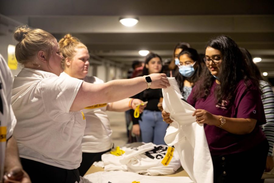 WSU students receiving T-shirts at the 2nd Annual NXT LVL Garage party. The event was hosted by the Office of Diversity and Inclusion at the public parking garage on August 19, 2022.