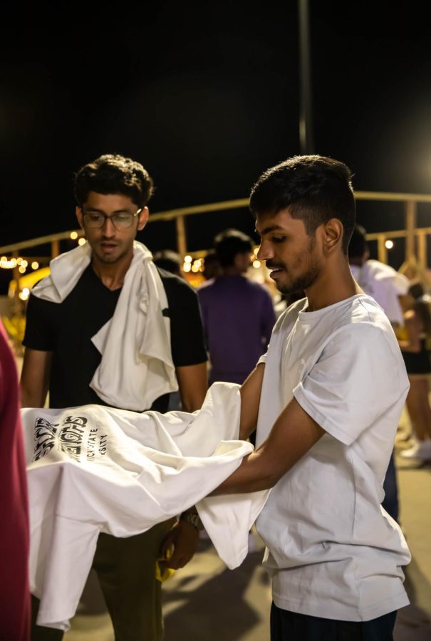 Grad student Srinath folding the T-shirt for dyeing at the 2nd Annual NXT LVL Garage party. The event was hosted by the Office of Diversity and Inclusion at the public parking garage on August 19, 2022.