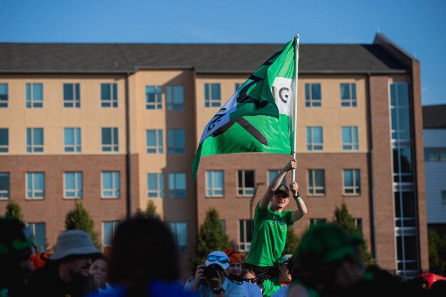 Sophomore Caleb Perkins representing the College of Engineering by proudly waving his schools flag on his teammates shoulders. The College of Engineering took first place on Aug. 26 during the Clash of Colleges.