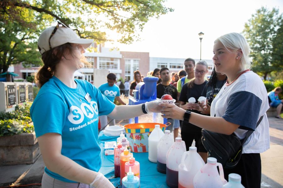 WSU student receives sno-kones at the beach party. The event was hosted by SAC at RSCs east courtyard on Aug 25.