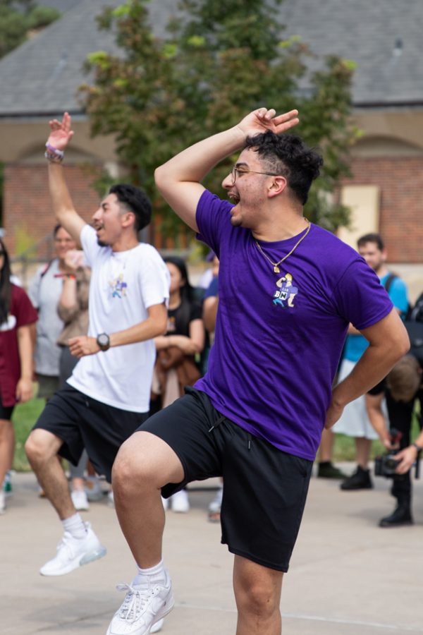 Andres Arvizu dances with other members of Sigma Lambda Beta during the Yard Show event outside the RSC on Aug. 29.