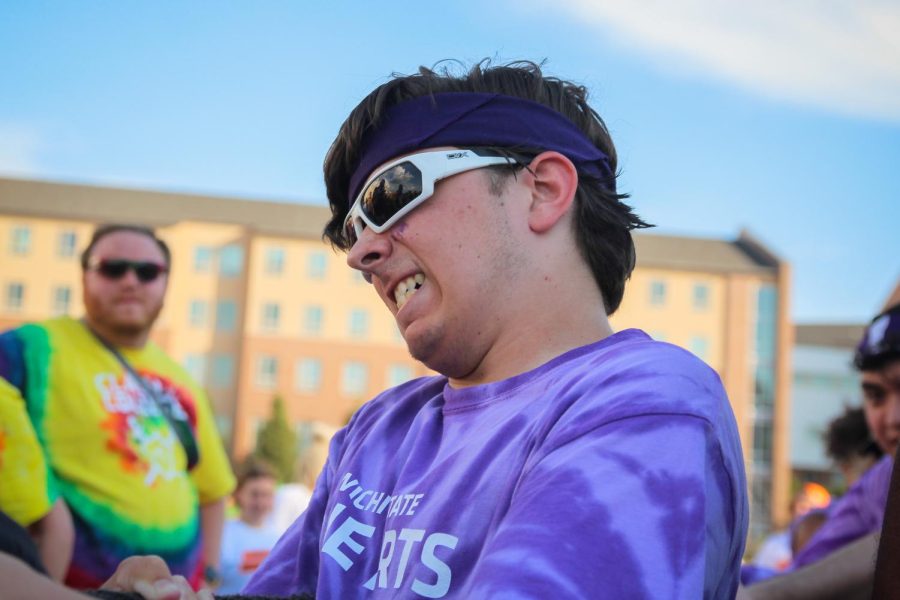 College of Fine Arts student participates in tug-of-war at the Clash of the Colleges on Aug. 26, 2022.
