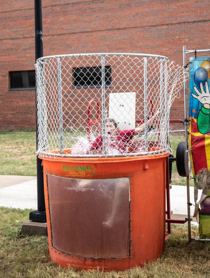 Junior Christi James falls into dunk tank at the Alpha Phi Sorority at the Greek Carnival on Aug. 27.