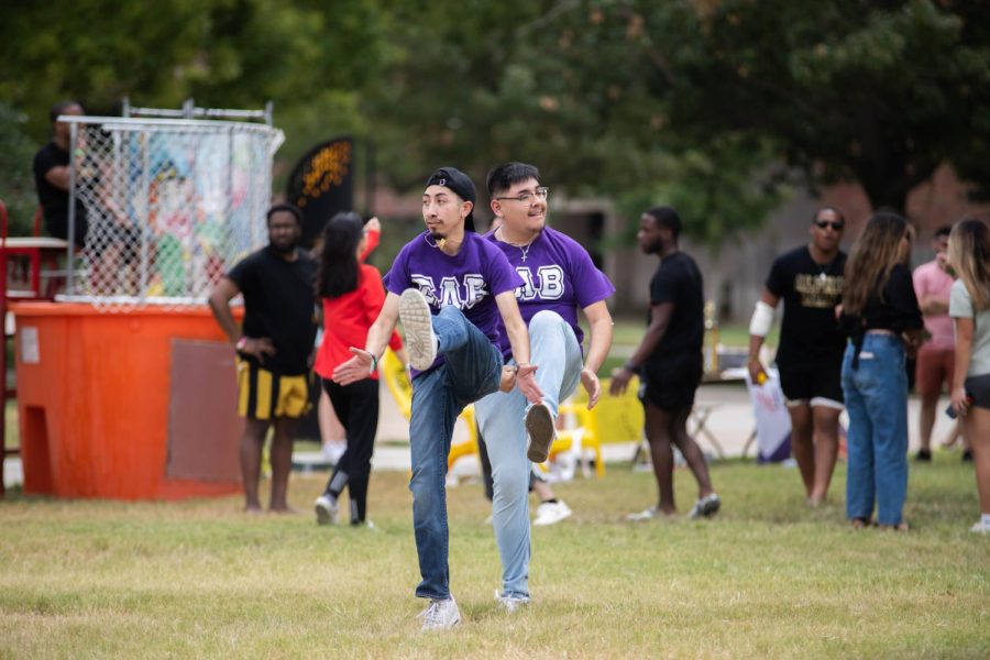 Senior Andres Saenz and Junior Jazciel Zapata from the Sigma Lambda Beta Frat dance at the Greek Carnival on Aug. 27.
