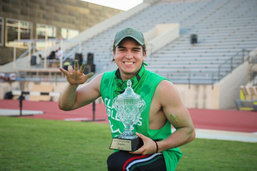 Junior Jose Ruiz poses with the Clash of the Colleges trophy. The College of Engineering placed first in the Clash of the Colleges 2022 on Aug. 26.