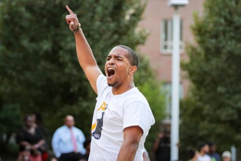 Devin Moore of Alpha Phi Alpha Fraternity Inc. hypes up the crowd at the first annual NPHC Yard Show. The Yard show was held on Aug. 29, 2022.