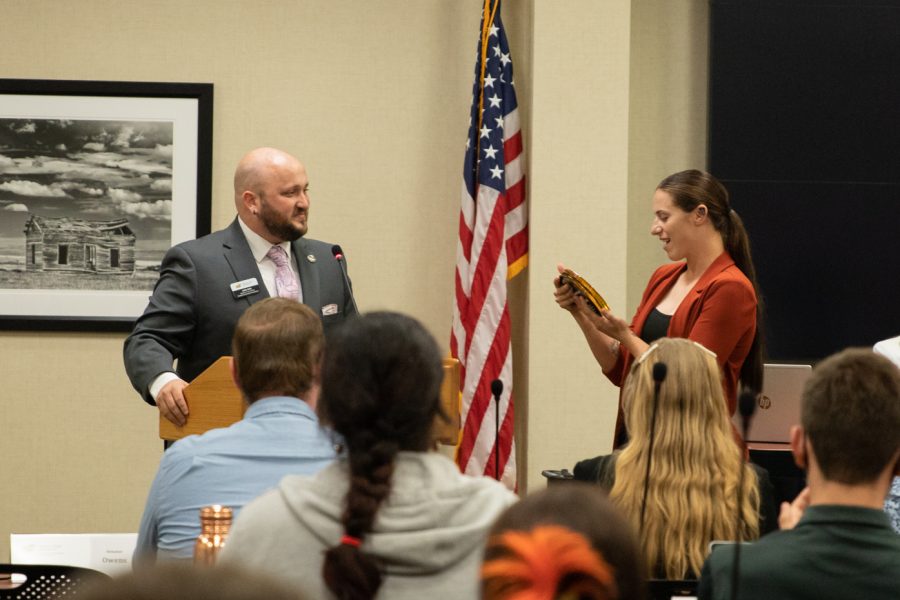 Speaker of the Senate John Kirk gives WSU softball player Sydney McKinney The Golden Sunflower. The award was presented to an individual that SGA wanted to highlight.