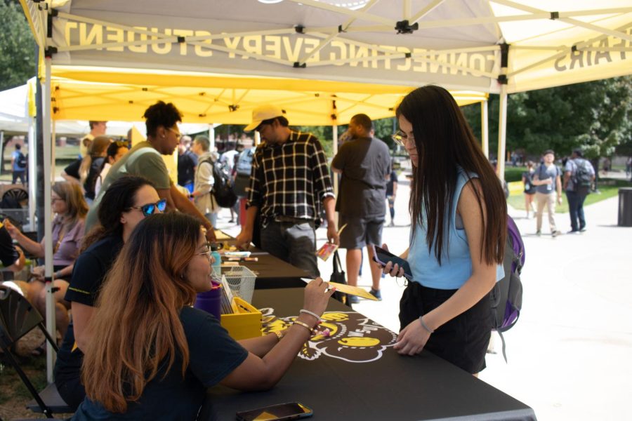 Wichita State Student checks out the Student Affairs pop-up tent outside the RSC the first day of school Aug. 22.