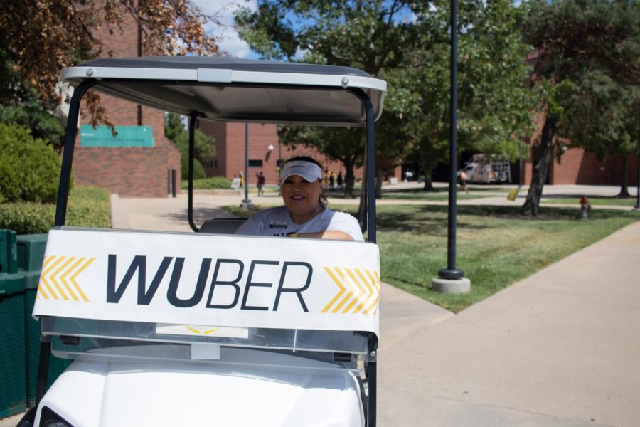 Alicia Martinez Newell, assitant vice president of student affairs races around campus to WUbers anyone who needs help or a quick ride on the first day of class on Aug. 22.
