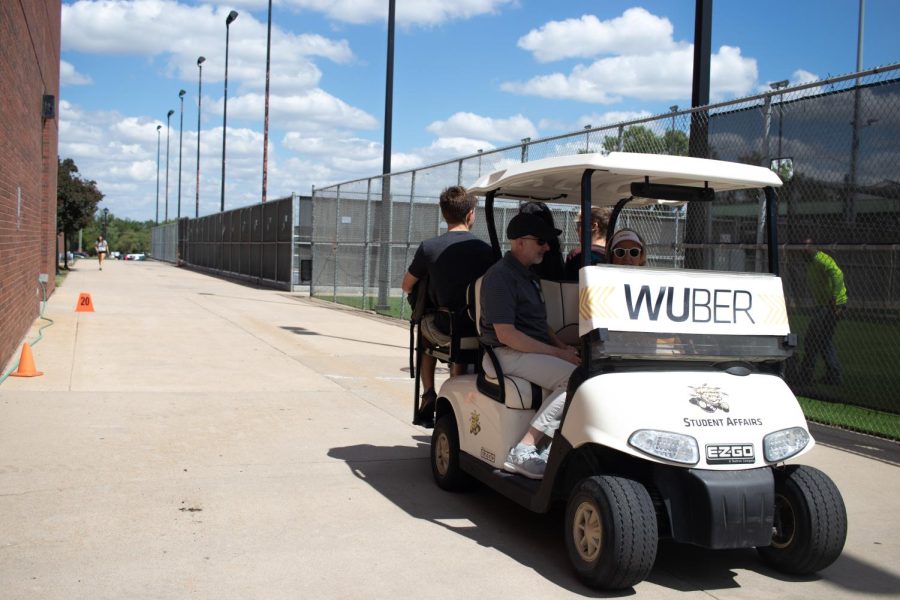Wichita State Faculty and students piled on a WUber zooming across campus for the first day of class Aug. 22.