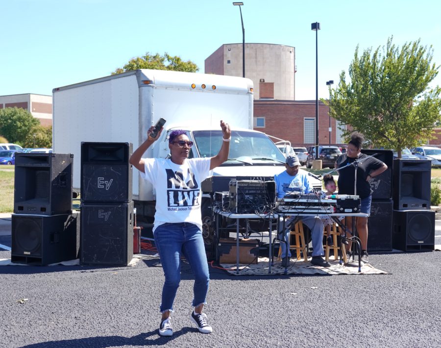 Lady dances at Show N’ Shine car show in parking Lot 1 between Hillside Avenue and the Duerksen Fine Arts Center on Sunday, Sept. 25.