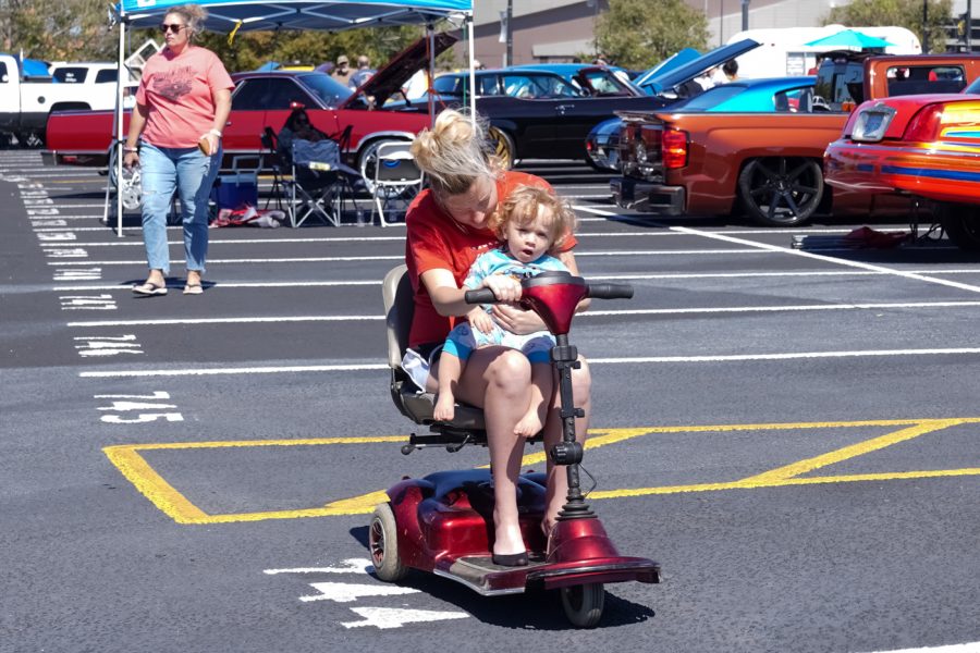Mom and Baby has some fun at Show N’ Shine car show in parking Lot 1 between Hillside Avenue and the Duerksen Fine Arts Center on Sunday, Sept. 25. This event was hosted by The Honore Adversus Foundation.