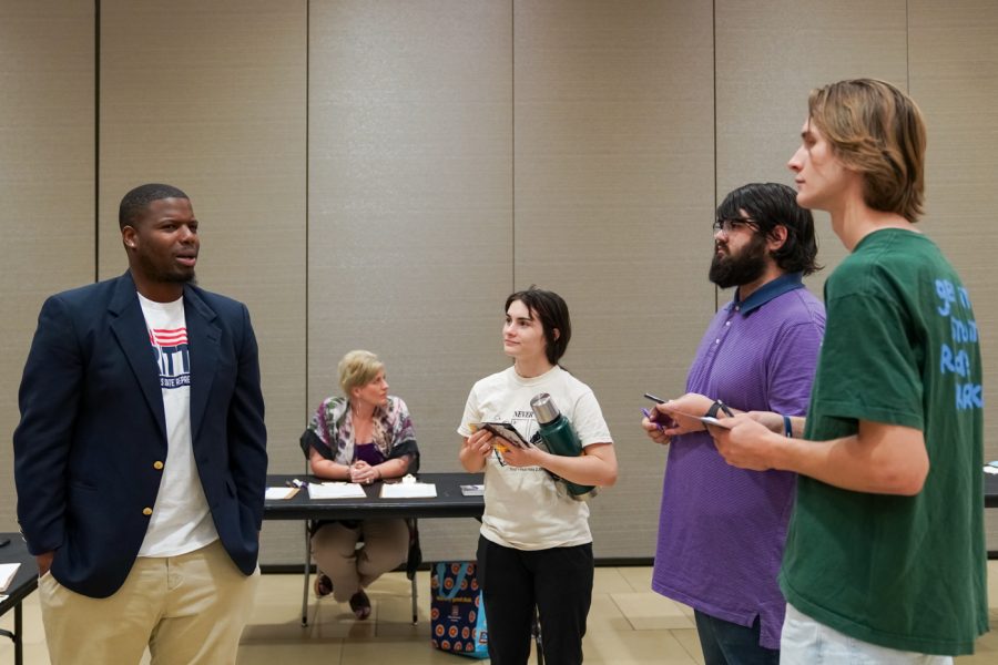 Jalon Britton, candidate for Kansas representative of District 85, interacts with students involved with Student Government Association at the local candidate meet and greet event on Sept. 26.