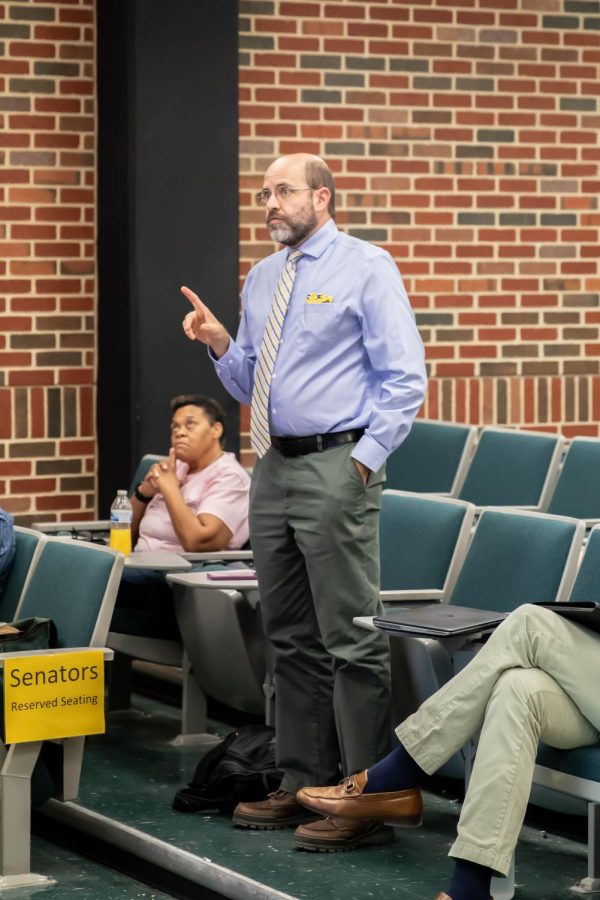 Neal Allen, associate professor in political science, speaks at Faculty Senate Meeting on Sept. 12. Emporia State Universitys plan to terminate tenured professors was a large part of the meetings discussion.