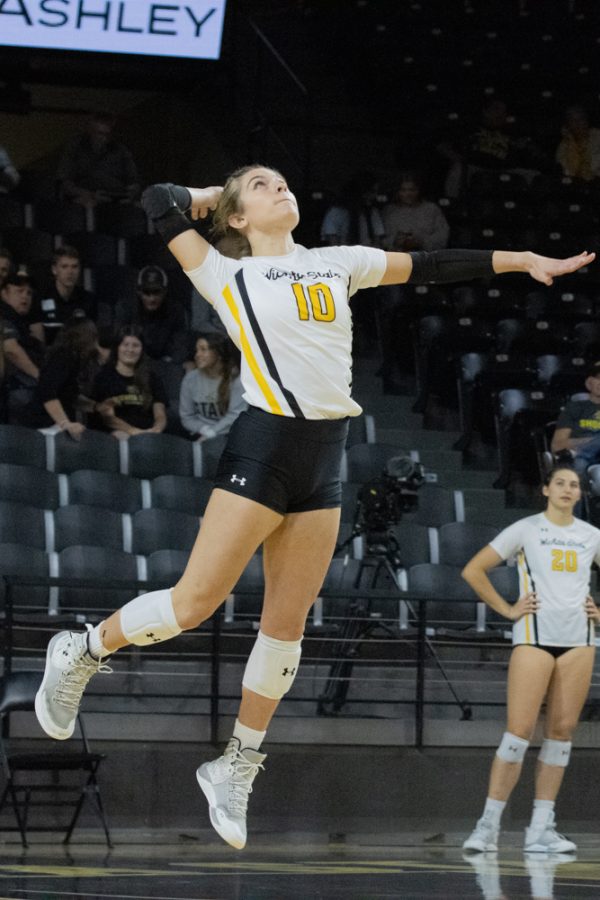 Sophmore Annalie Heliste serves the ball to Temple on Sep. 23. at Charles Koch Arena. Heliste completed two sets played.