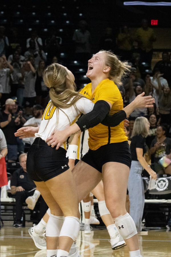 Annalie Heliste and Lily Leikweg celebrate their win against Temple on Sept. 23 at Charles Koch Arena. The Shockers won 3-0.
