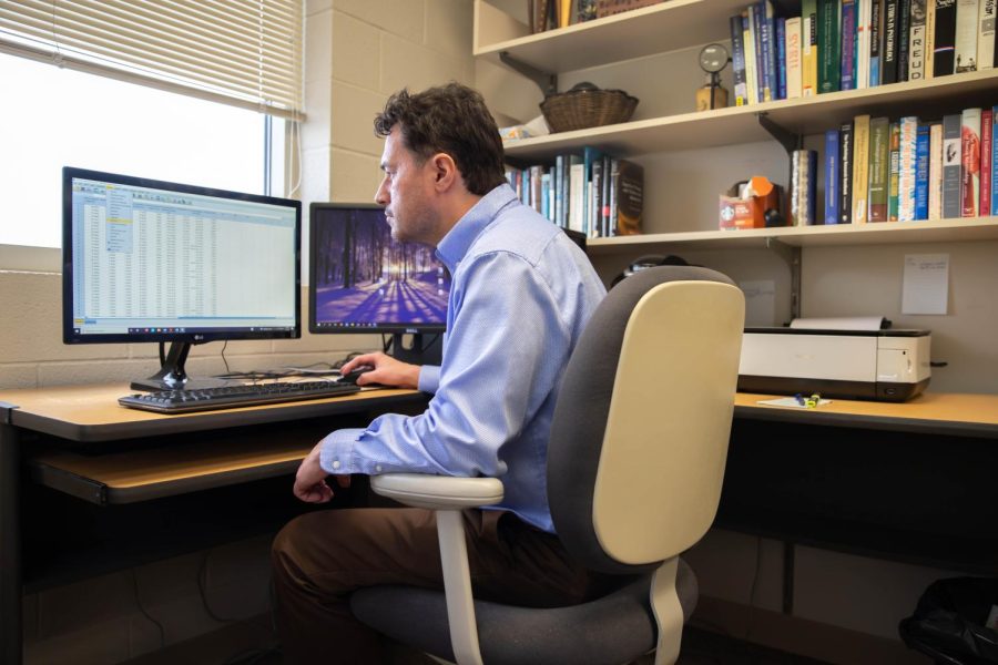 C. Brendan Clark, psychology associate professor and chair, works in his office on Sept. 1.