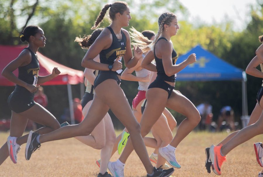 Wichita States womens cross country team begins the 5 Kilometers race during the JK Golden Classic on Sept. 3 in Augusta. The team took first place -- with 15 points -- over Emporia St., Friends and Sourhwestern.