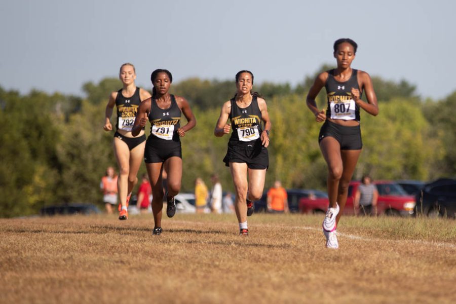 The womens cross country team takes an early lead during the JK Golden Class on Sept. 3 in Augusta. The team took first place with 15 scored points.