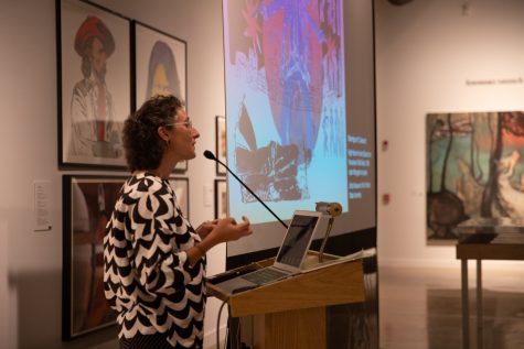 Ulrich Museum of Art Curator, Ksenya Gurshtien, speaks to attendees about the Myths of the West Fall exhibition at Curator Talk on Sept. 20.