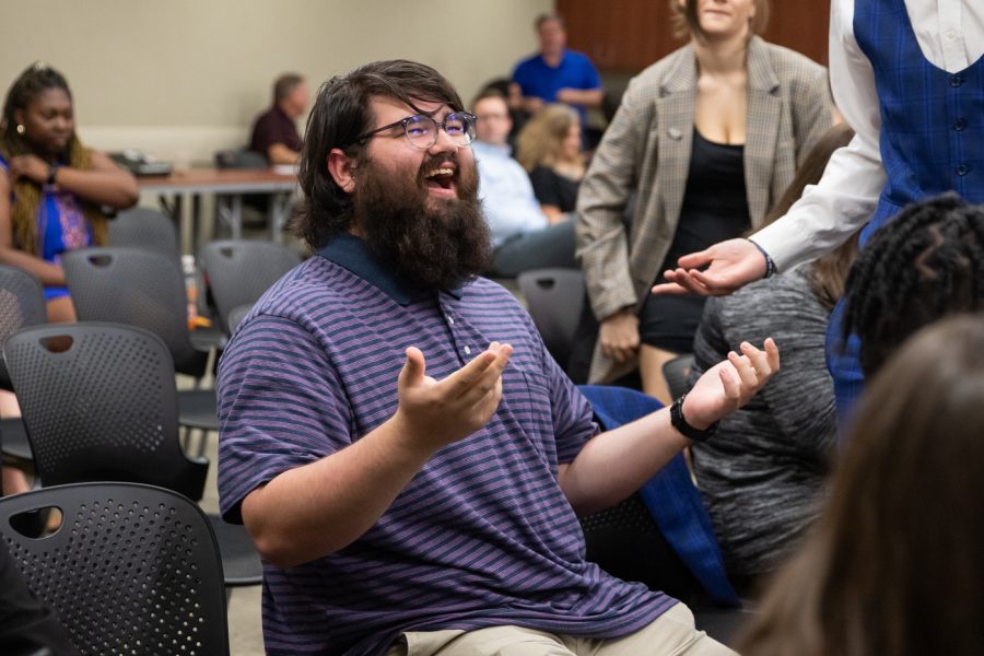 At-large senator Jonathan Stanger laughs with his fellow SGA members before The State of the Student Body Address on Sept. 7.
