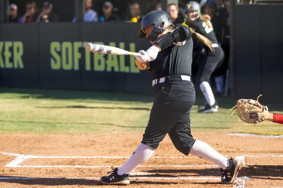 Zoe Jones takes a swing during WSU’s game against Seminole State on Sept. 27 at Wilkins Stadium.
