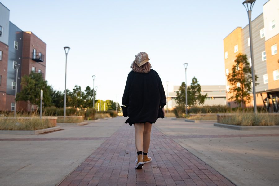 Junior Denae Sawyer walks past the Flats and Suits to clear her mind on Sept. 27. Sawyer frequently walks around campus feeling safe due to the officers on campus and the Guardian App.