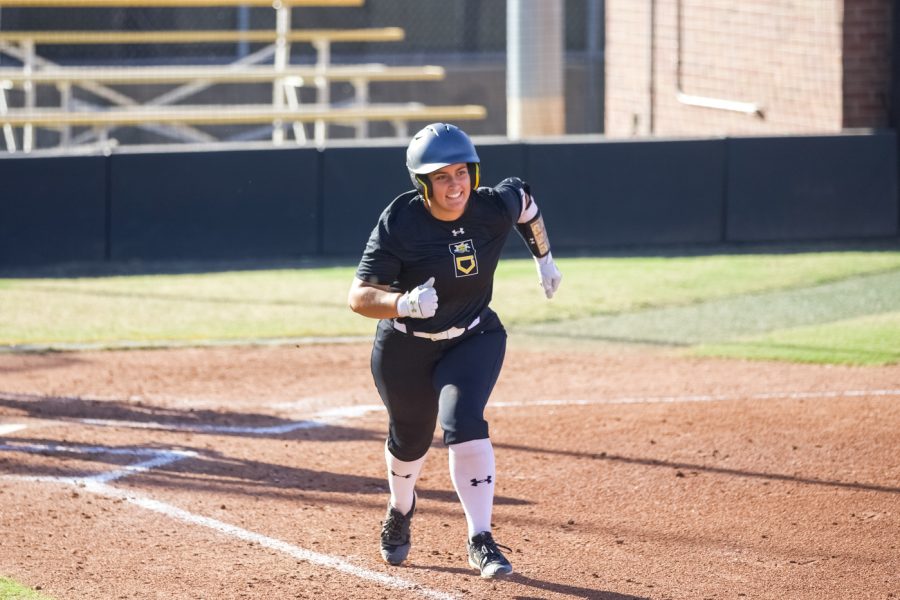 Jessica Garcia smiles to her team after a run for the Shockers during the game against Seminole State on Sept. 27 at Wilkins Stadium.