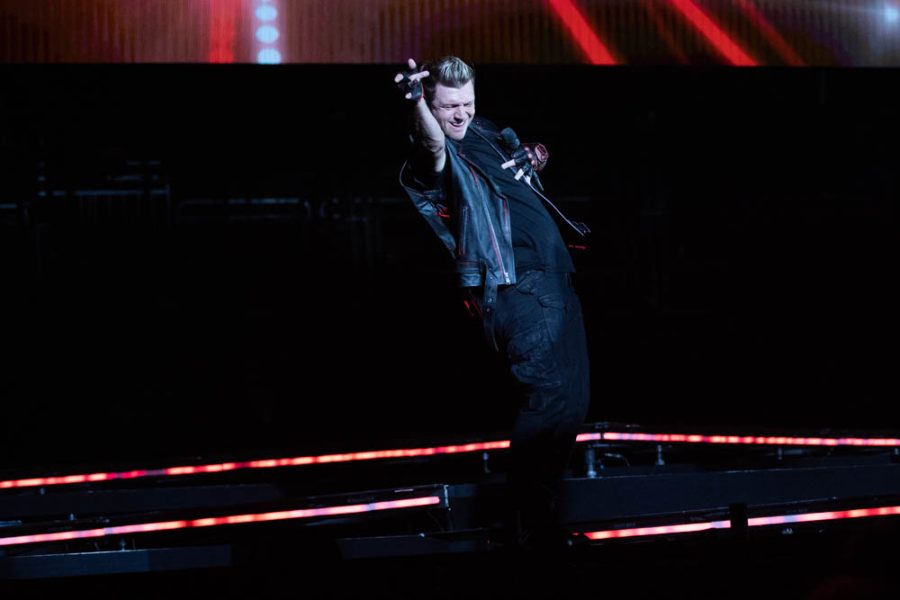 Nick Carter draws in cheers from the pit as he poses during the Everybody opening number on Sep 13 in Intrust Bank Arena.