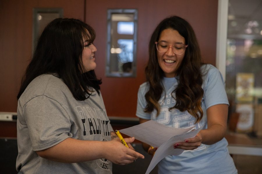 Michelle Rivera, senior, and Micaia Palacios, exchange student, play a game of BINGO at the Transfer Social on Sept. 19.