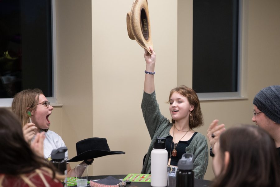 Freshman Lily Shaw waves her hat in the air on Sept. 22 during Western Bingo. The student with the best hat was picked to select the next Bingo card.