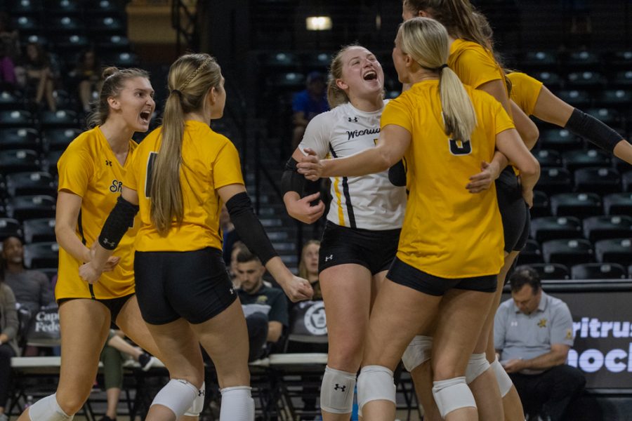 The Shockers go in for a group celebration after a set point against Tulsa on Oct. 12 at Charles Koch Arena.