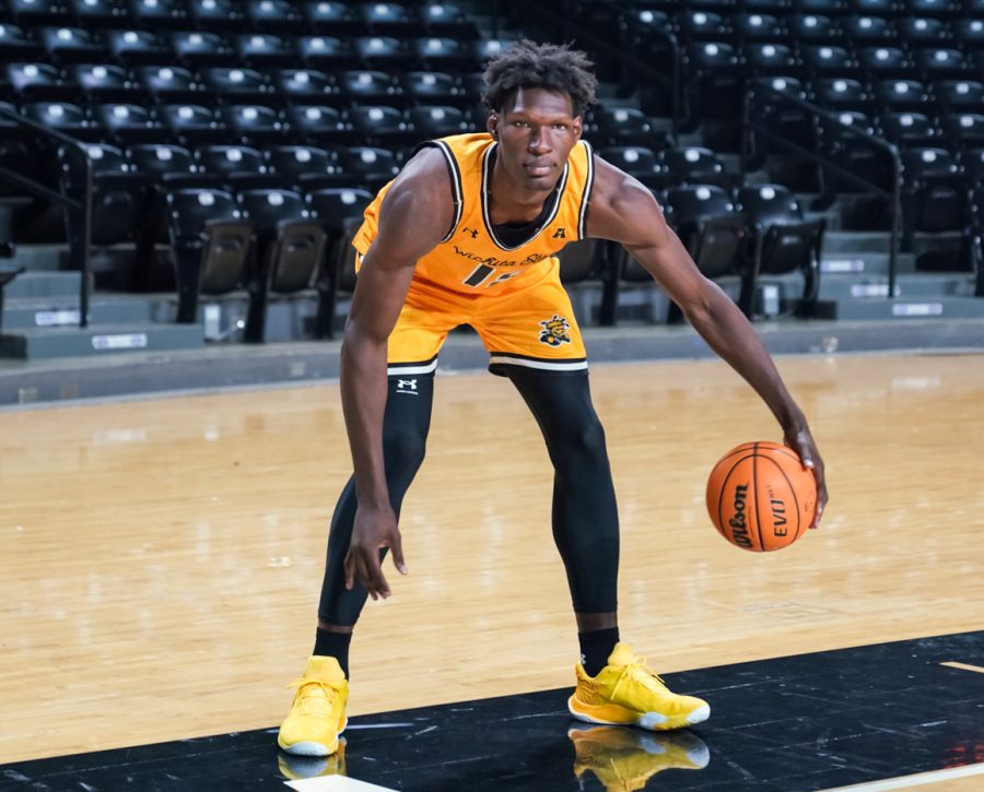 Sophomore Quincy Ballard poses for a photo with the ball at Charles Koch Arena on Oct. 18.