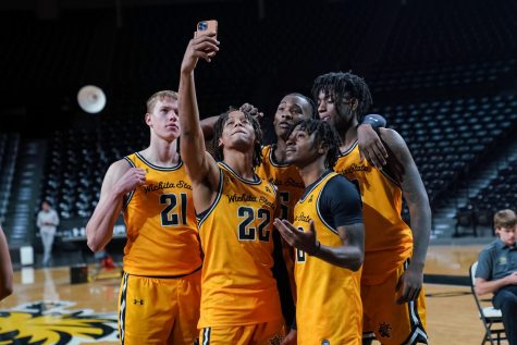 Mens Basketball team poses for a group selfie at Charles Koch Arena on Oct. 18.