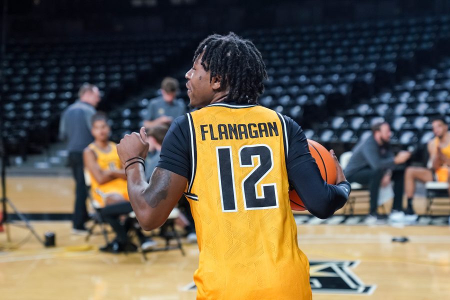 Sophomore Melvion Flanagan poses for a photo with the ball at Charles Koch Arena on Oct. 18.