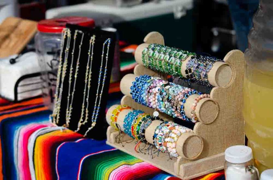 Tacos Pina, a local food vendor, offers handmade jewelery with their tacos. On Sunday, Tacos Pina set up shop at Naftzger Park for the monthly Shop and Grub.