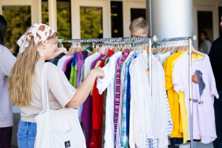 Wichita State student browses the clothing rack at the Dead Center Vintage Pop up event. The shop set up outside the Rhatigan Student Center on Oct. 20.