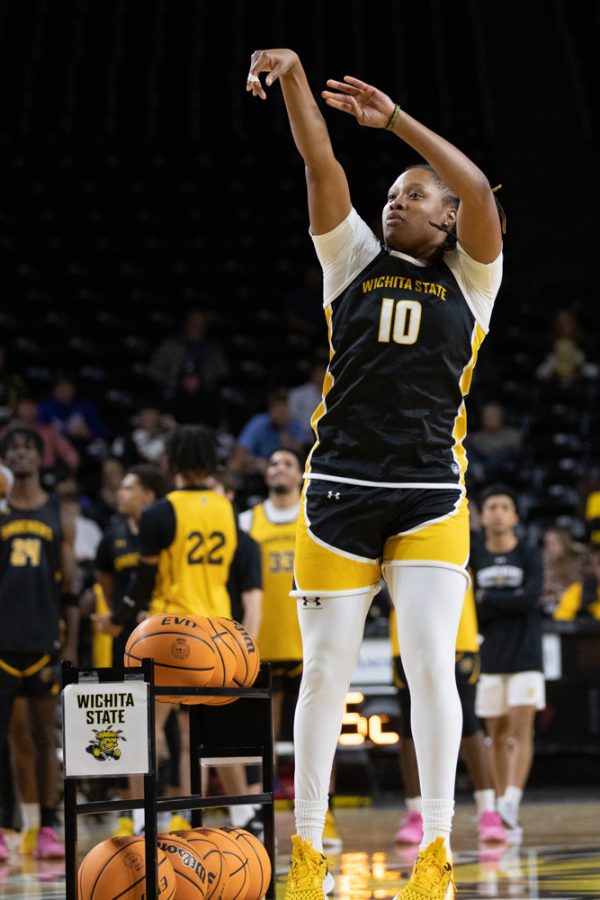 Graduate student Curtessia Dean shoots a 3-pointer during the 3-point contest on Oct. 27 during Shocker Madness. Dean represented the womens team in the final round against the mens team Colby Rogers.