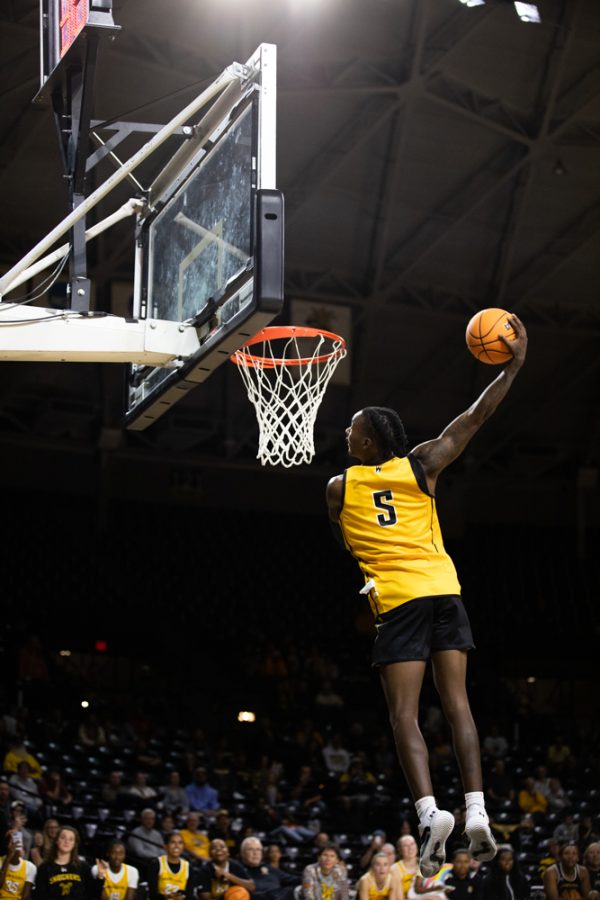 Sophomore Jaron Pierre Jr. makes a slam dunk during the Dunk Contest on Oct. 27 during Shocker Madness.