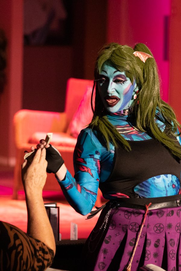 Zelda Darling takes a tip from an audience member on Oct. 9 at Roxys. Darling was a guest performer during Second Sunday Drag Brunch.